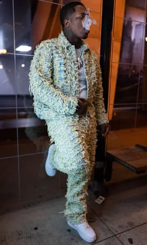 Lil Zay Osama wearing Who Decides War jacket