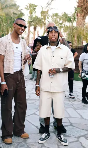 Tyga wearing Prada shirt