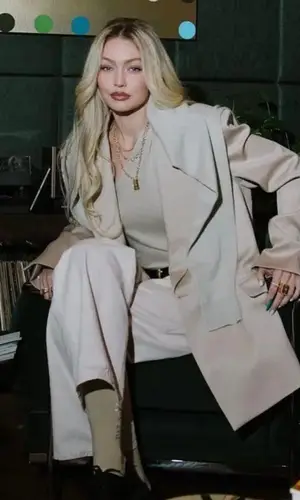 Gigi Hadid’s Outfit in Guest In Residence Top, Nili Lotan Belt & Loro Piana Bag (2023)
