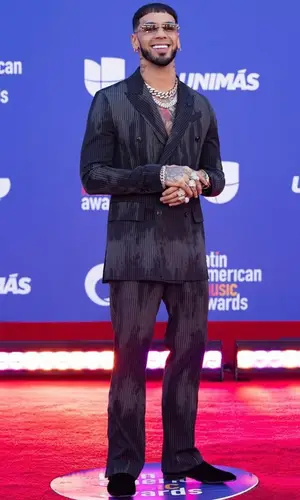 Anuel AA wearing Amiri trousers