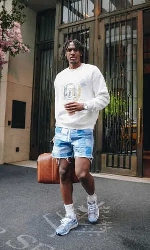 Tyrese Maxey’s Outfit in Kith Sweatshirt, New Balance Sneakers & Gucci Bag (2023)