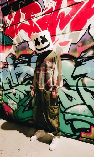 Marshmello’s Outfit in Jean Paul Gaultier Jeans, Nike Sneakers & Marshmello Merch (2023)