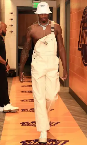 Lonnie Walker IV wearing Prada suit
