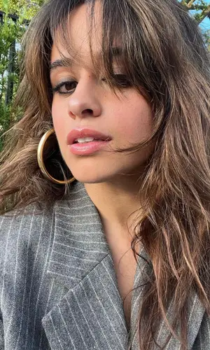 Camila Cabello wearing Alo Yoga top