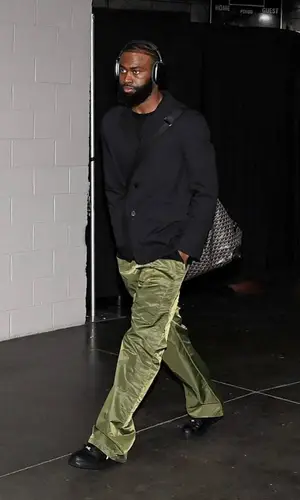 Jaylen Brown’s Outfit in Prada Pants, Goyard Bag & Apple (2023)