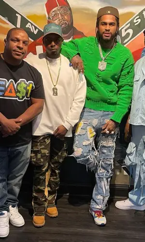 Dave East wearing Who Decides War jeans