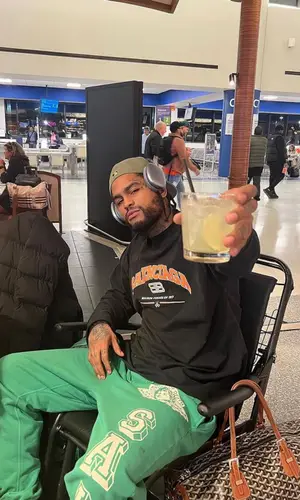 Dave East wearing Saint Michael pants