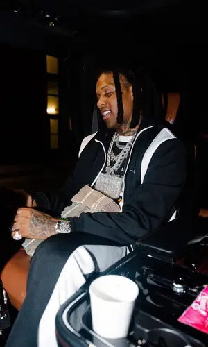 Lil Durk wearing Amiri pants