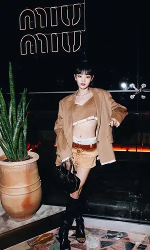 Minnie wearing Miu Miu jacket