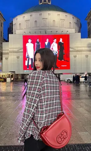 Jeon Soyeon wearing Ferragamo boots