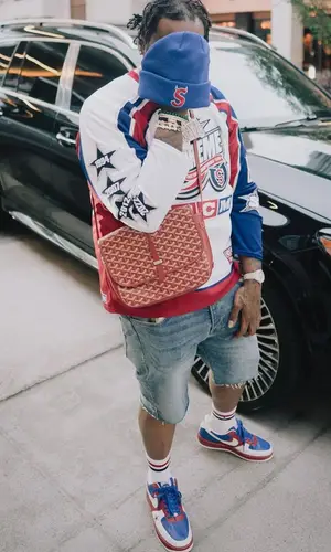 Peezy wearing Ralph Lauren sock