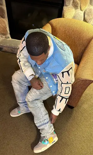 Lil Zay Osama wearing Who Decides War jacket