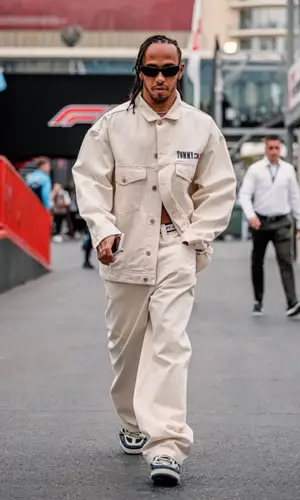 Lewis Hamilton’s Outfit in Tommy Hilfiger Jacket, Louis Vuitton Sneakers & Gucci Eyewear (2023)