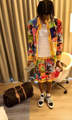 Soulja Boy wearing KidSuper shirt