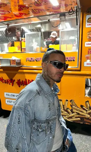 Rauw Alejandro wearing Feng Chen Wang jacket