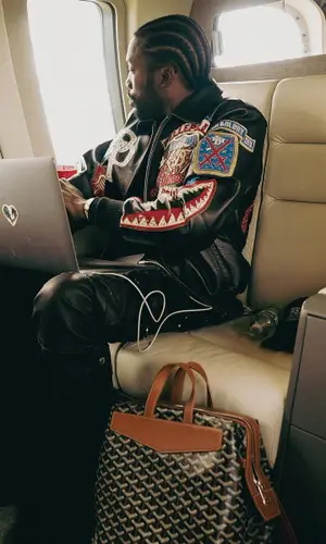 Meek Mill’s Outfit in Pelle Pelle Jacket, Amiri Pants & Goyard Backpack (2023)