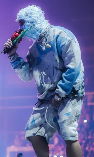 Anuel AA wearing Amiri hat