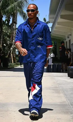 Lewis Hamilton’s Outfit in Tommy Hilfiger Shirt, Louis Vuitton Sneakers & Dior Eyewear (2023)
