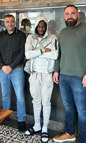 Russ Millions wearing Nike pants