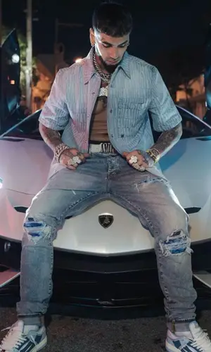 Anuel AA wearing Amiri jeans