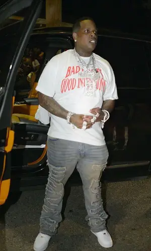 Finesse2tymes wearing Homme + Femme jeans