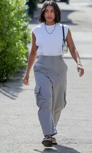 Lori Harvey’s Outfit in Loewe Trousers & Chanel Bag (2023)