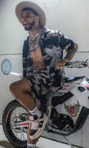 Anuel AA wearing Amiri shirt