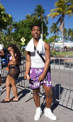Badkid Jay wearing Purple Brand shorts