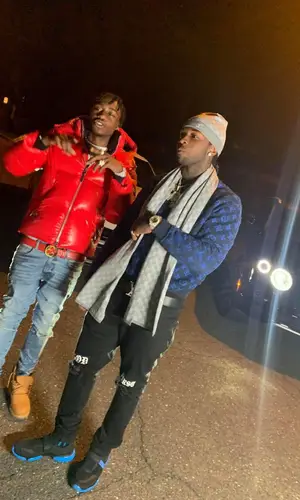 Pop Smoke wearing 365 Clothing jeans