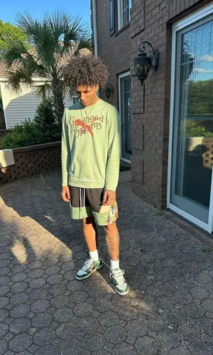 Mikey wearing Puma t-shirt