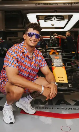 Patrick Mahomes II’s Outfit in Louis Vuitton Shirt, Oakley Eyewear & Versace Socks (2023)