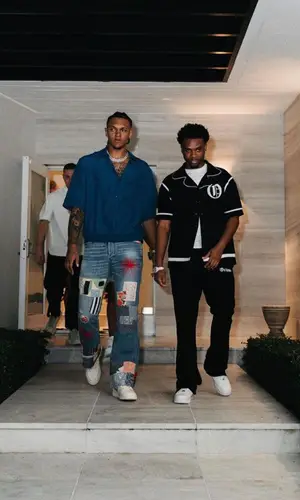 Paolo Banchero wearing Louis Vuitton shirt