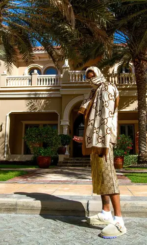NLE Choppa wearing Gucci shorts
