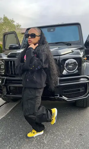 Money Yaya wearing Saint Laurent eyewear