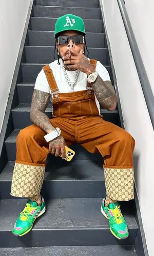 Westside Gunn’s Outfit in Gucci Sneakers, Givenchy Eyewear & New Era Cap (2023)