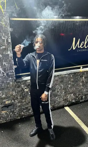 BandoKay wearing Palm Angels t-shirt