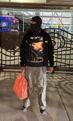 Jules Kounde wearing Goyard backpack