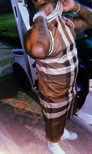 EST Gee wearing Burberry shorts