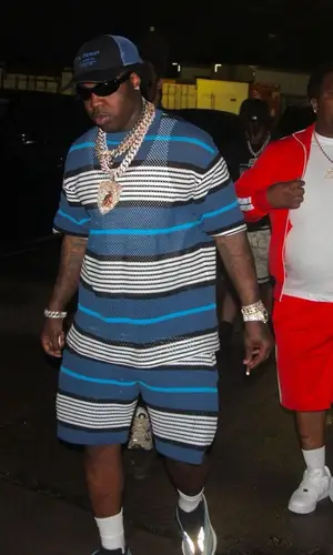 EST Gee wearing Burberry shorts