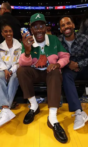 Tyler, The Creator’s Outfit in Golf Wang Jacket, Gucci Eyewear & New Era Cap (2023)