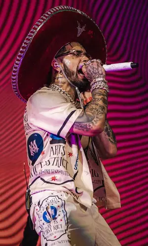 Anuel AA wearing Amiri shirt