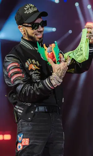 Anuel AA wearing Amiri jacket