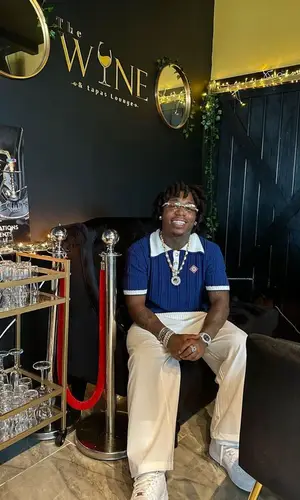 Jacquees wearing Casablanca trousers