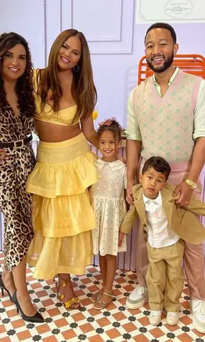Chrissy Teigen’s Outfit in Zimmermann Top & Aquazzura Sandals (2023)