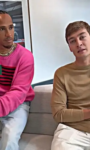 Lewis Hamilton wearing Denim Tears sweater