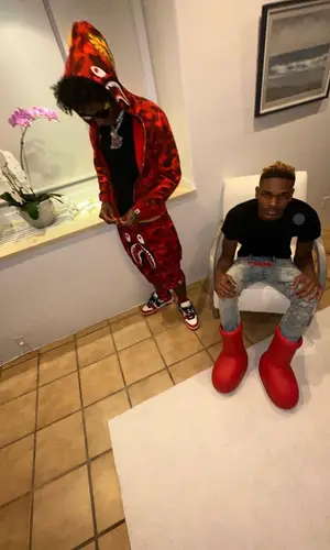 Mikey wearing Bape shorts