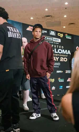 Devin Haney wearing Needles pants