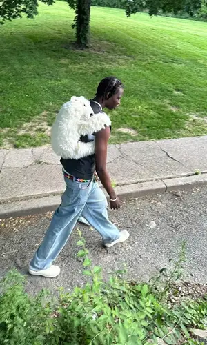 Bol Bol’s Outfit in Dolce & Gabbana Jacket, Gucci Hoodie & Chrome Hearts Belt (2023)