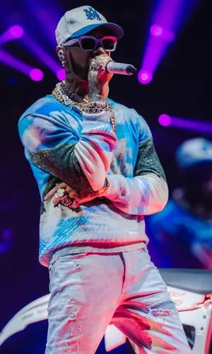Anuel AA wearing Amiri sweater
