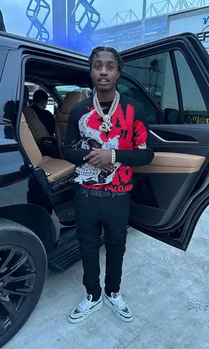 Lil Tjay wearing Louis Vuitton belt